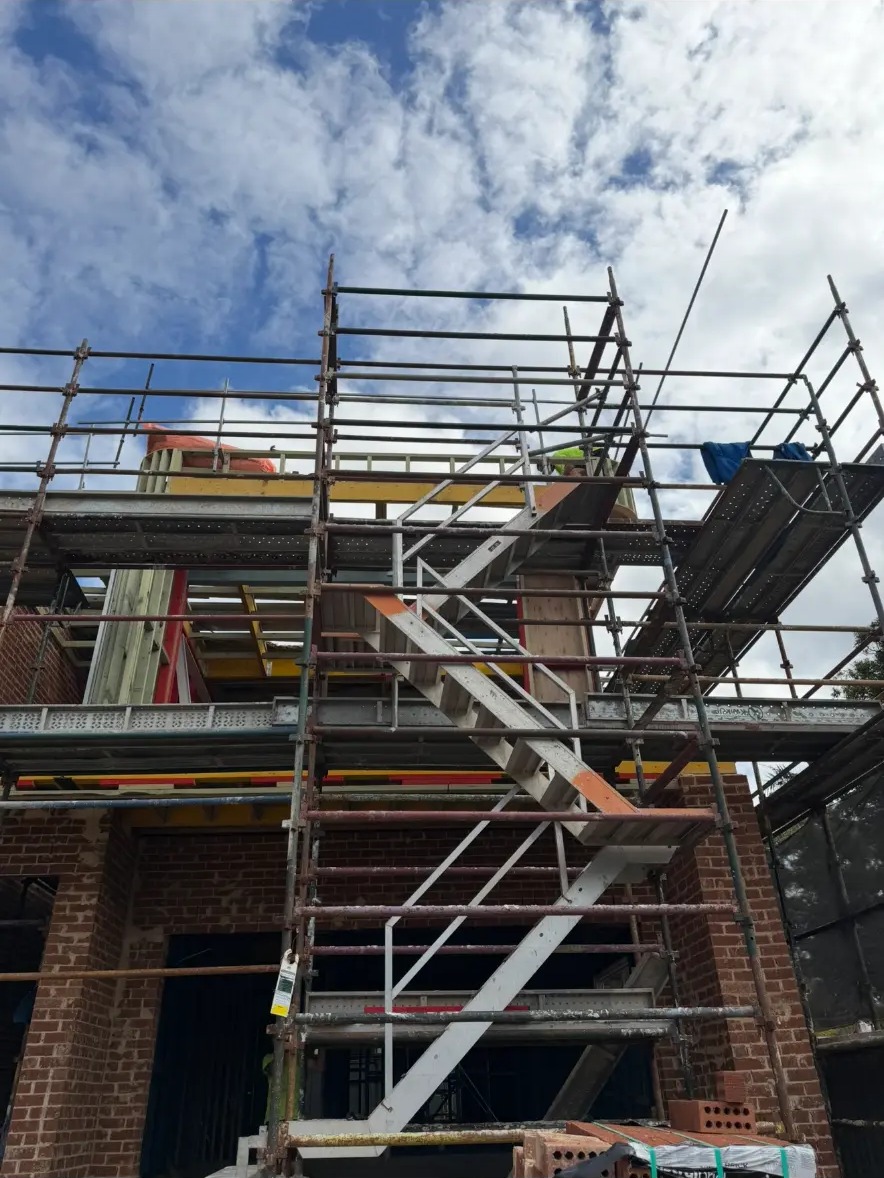 Scaffolded residential build in Sydney with roofing works underway by Marvel Roofing Projects